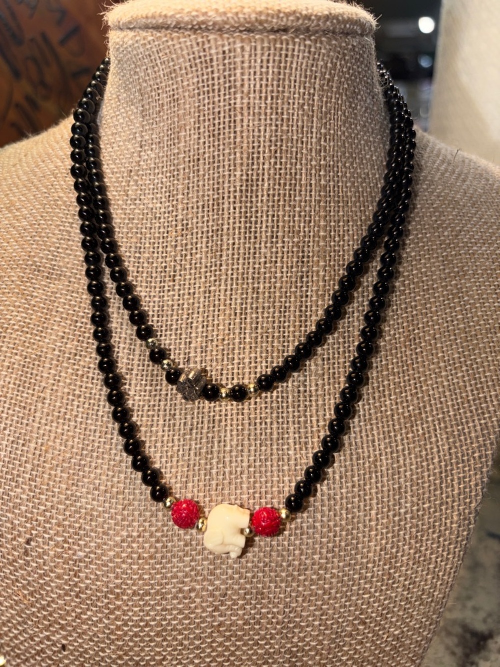 Black Beaded Double-Strand Necklace with Red Accents and Ivory Elephant